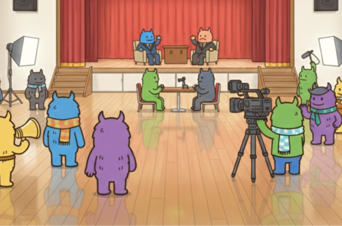 学校の講堂や教室のようなステージがある部屋で、本格的なカメラや照明機材を使い、対談シーンの撮影を行っている色違いの「でっかいくん」たちのイラスト。